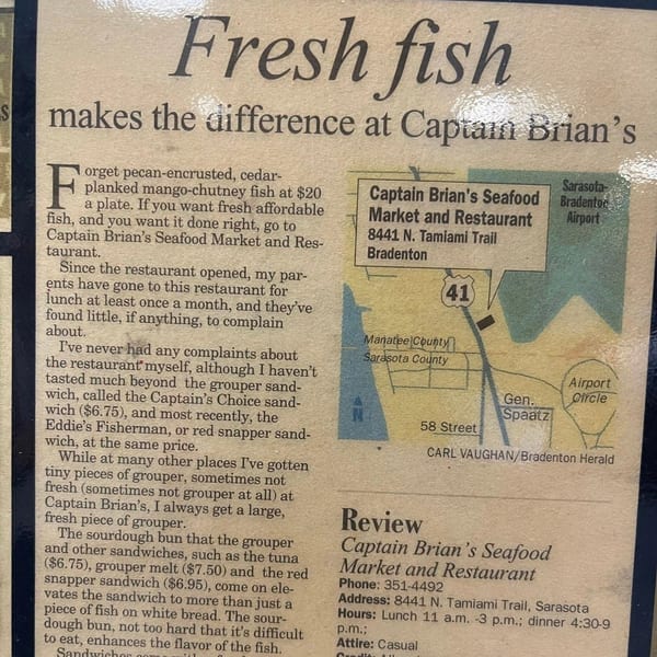 Newspaper clipping with a review of Captain Brian's Seafood Market & Restaurant, including a map.